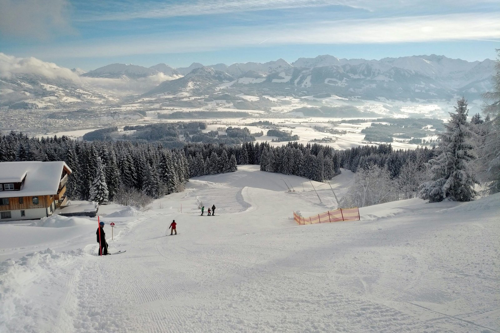 people walking on snow covered field during daytime