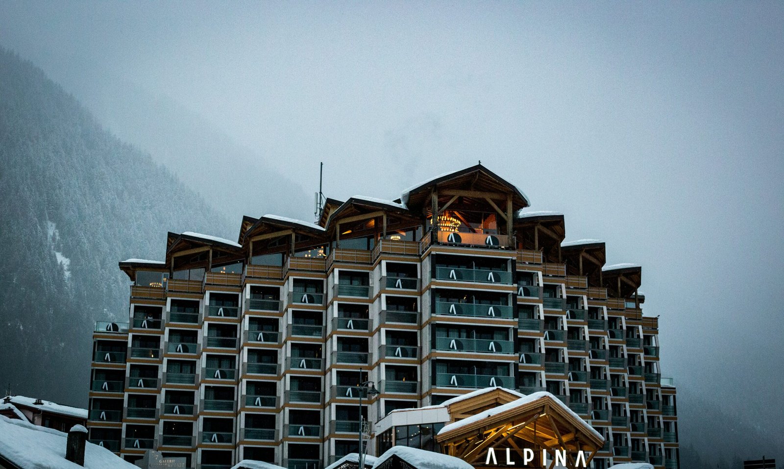 shallow focus photography of brown and black concrete structure near mountains